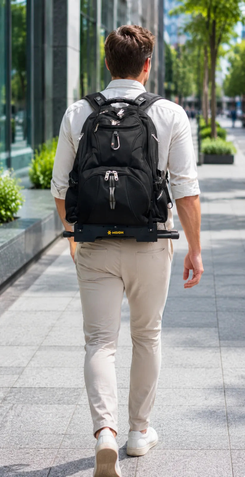 Rear carry view of the 9-inch depth of the Ryzer Go mounted to a black backpack with its legs folded for travel